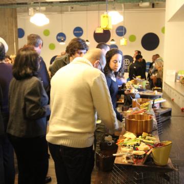 Guests getting catered food at Anchor Ventures meeting